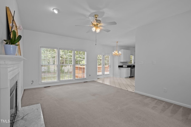 8 Summertime Ct, Durham, NC 27707 - unfurnished living room with ceiling fan, light carpet, and a chandelier