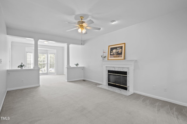 8 Summertime Ct, Durham, NC 27707 - unfurnished living room featuring a ceiling fan, carpet floors, a high end fireplace, and decorative columns