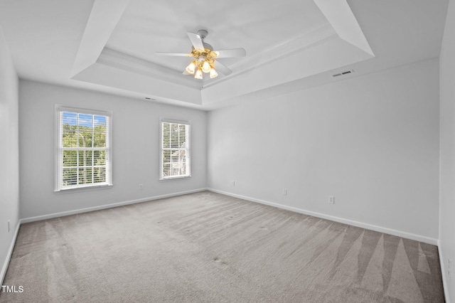 8 Summertime Ct, Durham, NC 27707 - spare room featuring a tray ceiling, carpet floors, and ceiling fan