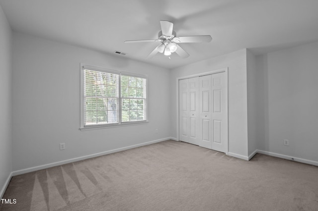 8 Summertime Ct, Durham, NC 27707 - unfurnished bedroom featuring carpet, a closet, and ceiling fan