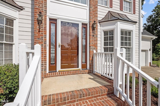 8 Summertime Ct, Durham, NC 27707 - entrance to property with a garage and brick siding