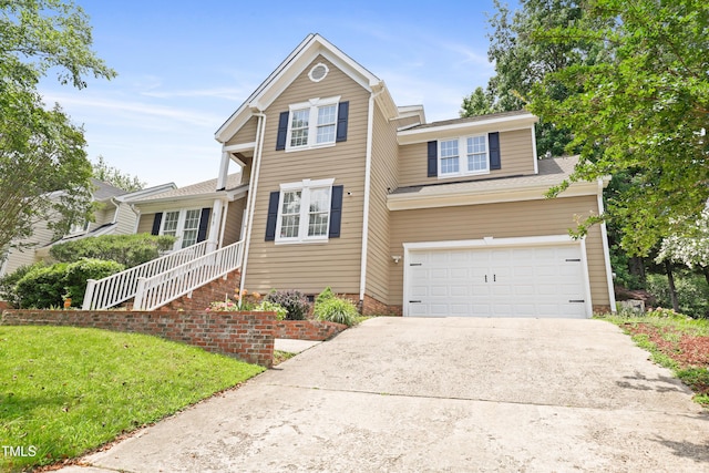 613 Penncross Dr, Raleigh, NC 27610 - traditional home with driveway, a garage, and a front yard