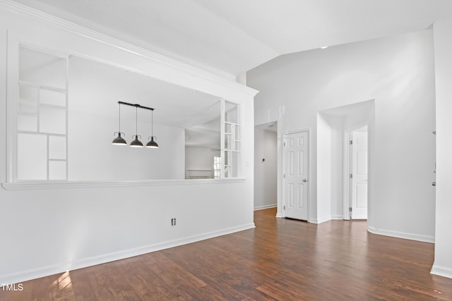 613 Penncross Dr, Raleigh, NC 27610 - spare room featuring vaulted ceiling and wood finished floors