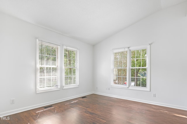 613 Penncross Dr, Raleigh, NC 27610 - empty room with vaulted ceiling and dark wood finished floors