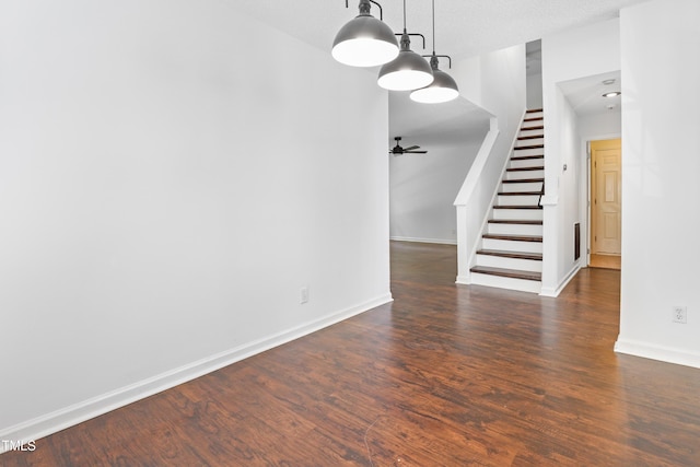 613 Penncross Dr, Raleigh, NC 27610 - unfurnished dining area with stairs, dark wood-style floors, and ceiling fan