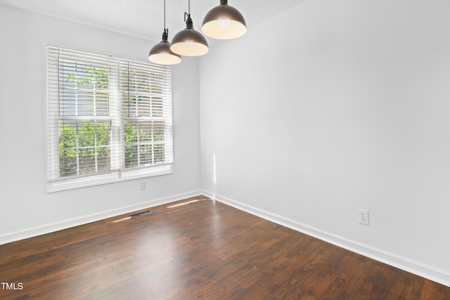 613 Penncross Dr, Raleigh, NC 27610 - empty room featuring wood finished floors and baseboards
