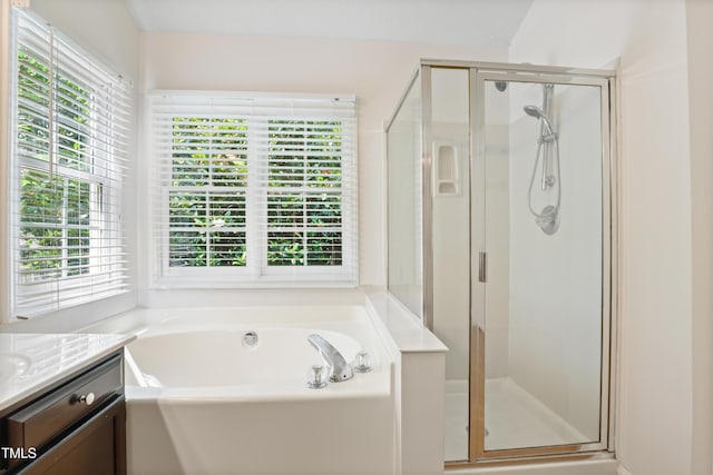 613 Penncross Dr, Raleigh, NC 27610 - full bathroom featuring healthy amount of natural light, vanity, and a stall shower