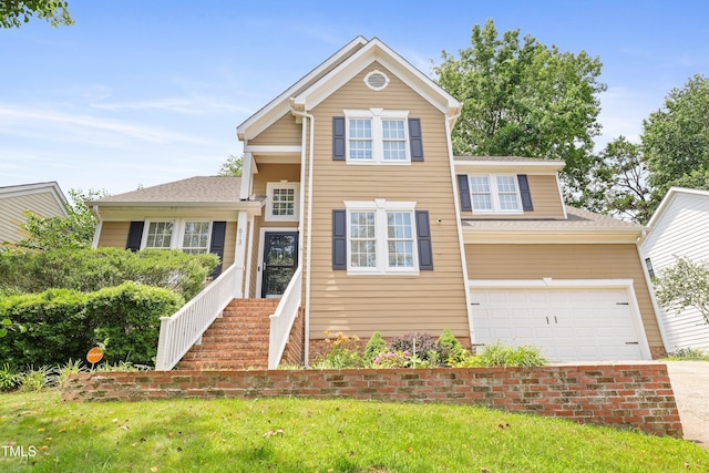 613 Penncross Dr, Raleigh, NC 27610 - view of front of property featuring a garage, driveway, a front lawn, and roof with shingles