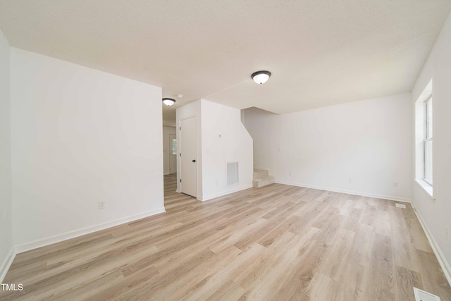 4258 Kaplan Dr, Raleigh, NC 27606 - bonus room featuring light wood finished floors and stairway