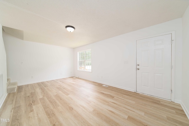 4258 Kaplan Dr, Raleigh, NC 27606 - unfurnished room featuring light wood-style floors and stairway