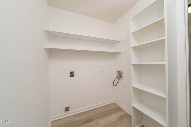 4258 Kaplan Dr, Raleigh, NC 27606 - washroom featuring hookup for an electric dryer, hookup for a washing machine, and wood finished floors