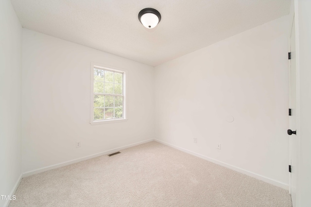 4258 Kaplan Dr, Raleigh, NC 27606 - carpeted spare room featuring baseboards