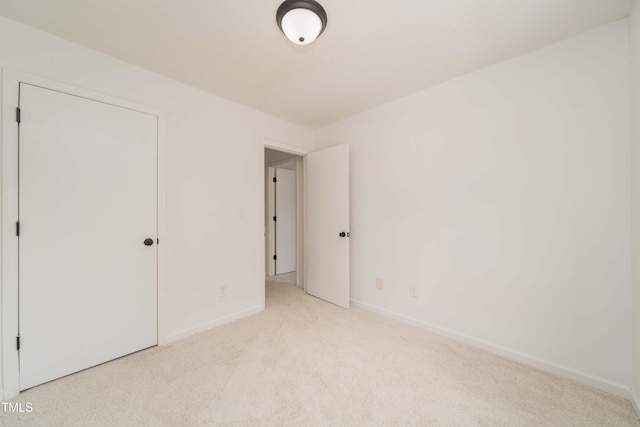 4258 Kaplan Dr, Raleigh, NC 27606 - unfurnished bedroom featuring light carpet and baseboards