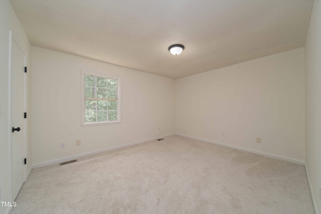 4258 Kaplan Dr, Raleigh, NC 27606 - carpeted spare room with a textured ceiling