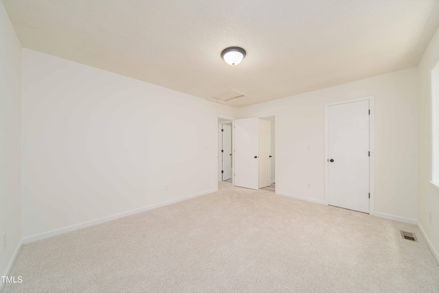 4258 Kaplan Dr, Raleigh, NC 27606 - unfurnished bedroom featuring carpet and attic access