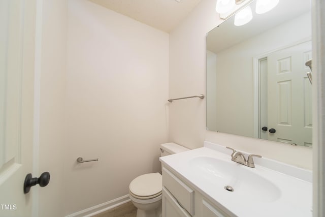 4258 Kaplan Dr, Raleigh, NC 27606 - bathroom featuring vanity and wood finished floors