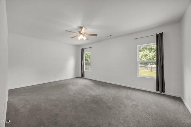 2021 W Front St, Burlington, NC 27215 - spare room featuring plenty of natural light, ceiling fan, and carpet flooring