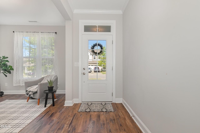 1127 Timbercut Dr, Durham, NC 27703 - foyer with wood finished floors, plenty of natural light, and ornamental molding