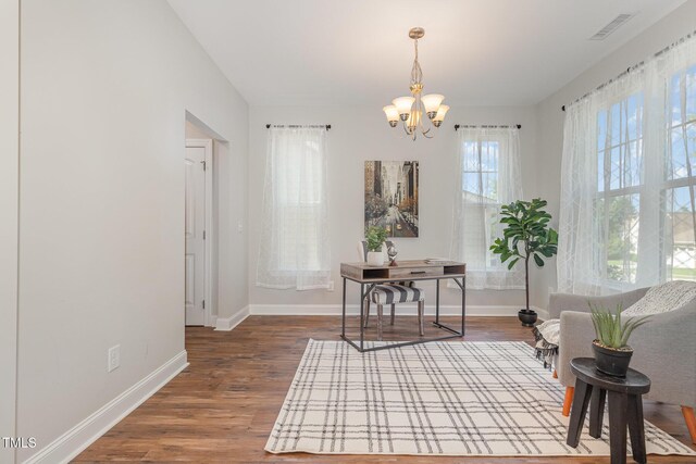 1127 Timbercut Dr, Durham, NC 27703 - office space with a chandelier and wood finished floors