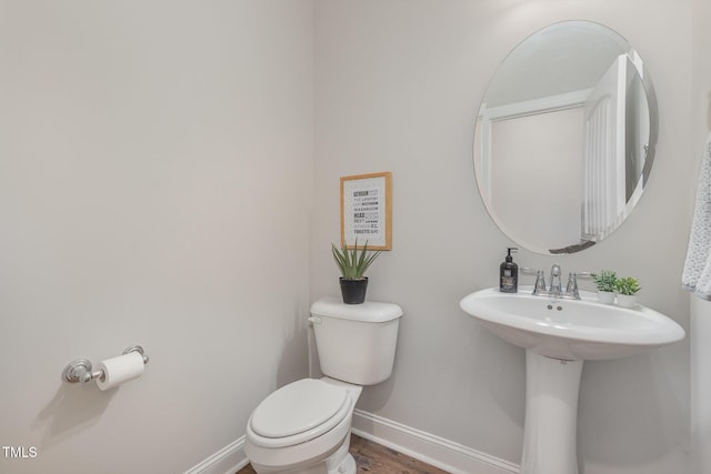 1127 Timbercut Dr, Durham, NC 27703 - bathroom with baseboards and wood finished floors