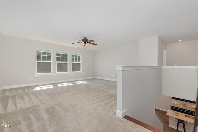 1127 Timbercut Dr, Durham, NC 27703 - carpeted empty room featuring a ceiling fan and recessed lighting