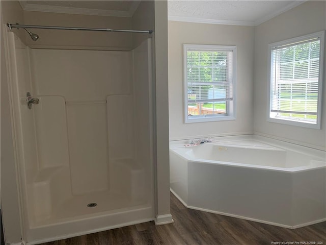 17340 Sneads Grove Rd, Laurinburg, NC 28352 - bathroom with wood finished floors, a bath, ornamental molding, a shower, and a textured ceiling