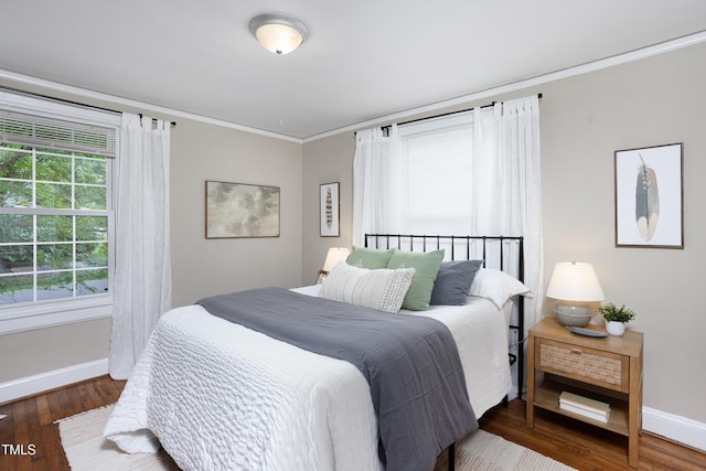 2423 Farthing St, Durham, NC 27704 - bedroom with crown molding and wood finished floors
