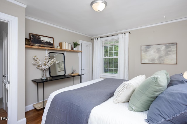 2423 Farthing St, Durham, NC 27704 - bedroom featuring crown molding and wood finished floors