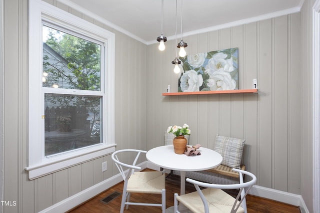 2423 Farthing St, Durham, NC 27704 - dining area featuring wood finished floors and ornamental molding