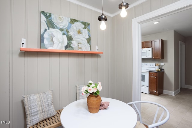 2423 Farthing St, Durham, NC 27704 - dining room featuring ornamental molding, a decorative wall, recessed lighting, and light tile patterned floors