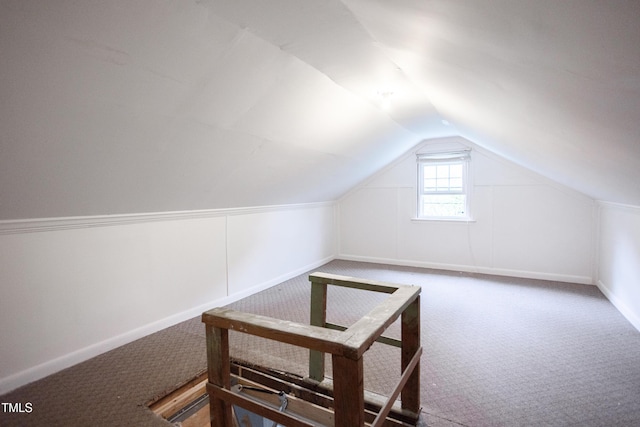 2423 Farthing St, Durham, NC 27704 - additional living space with carpet floors and vaulted ceiling