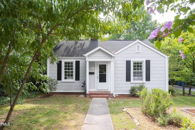2423 Farthing St, Durham, NC 27704 - bungalow with a shingled roof and a front yard