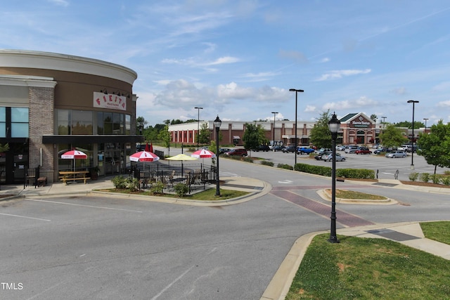 221 Carova Bnd, Apex, NC 27539 - view of asphalt street with street lighting, curbs, and sidewalks