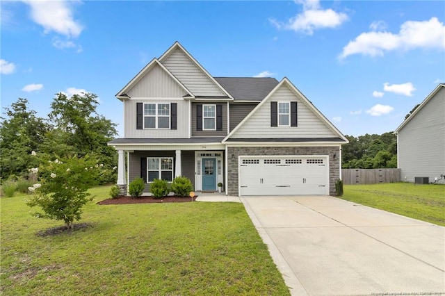 3902 Standardbred Dr, Hope Mills, NC 28348 - craftsman-style house with concrete driveway, stone siding, a porch, a garage, and board and batten siding