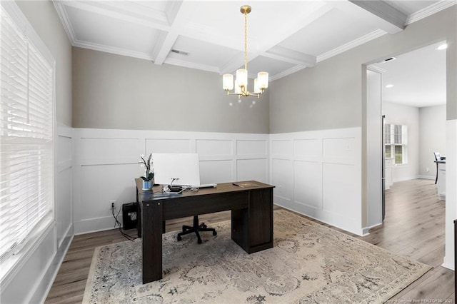 3902 Standardbred Dr, Hope Mills, NC 28348 - home office with coffered ceiling, beam ceiling, wood finished floors, ornamental molding, and a decorative wall