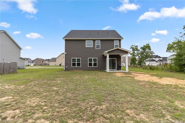 3902 Standardbred Dr, Hope Mills, NC 28348 - back of property featuring a patio, a yard, and a residential view