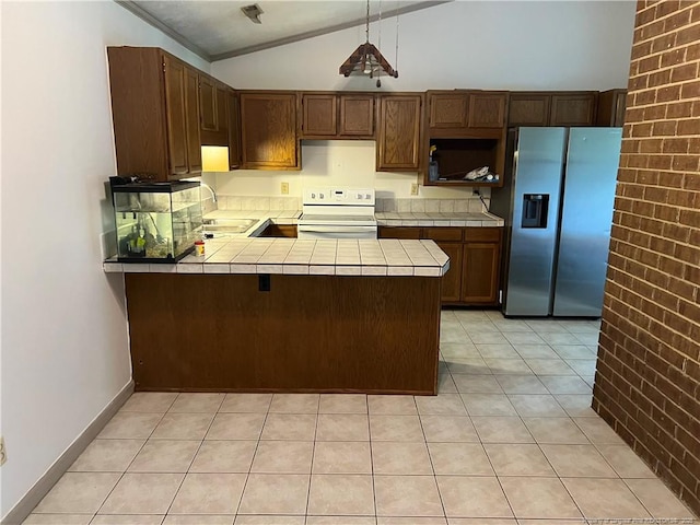 5200 Pineview Rd, Lumberton, NC 28360 - kitchen featuring stainless steel fridge with ice dispenser, tile countertops, white electric range, lofted ceiling, and a peninsula