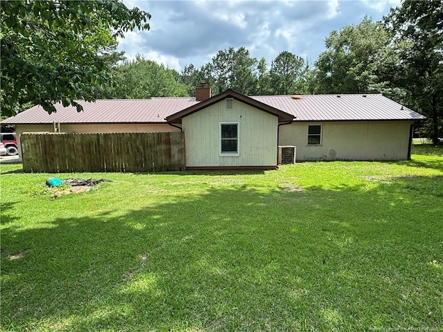 5200 Pineview Rd, Lumberton, NC 28360 - back of house featuring a metal roof and a chimney