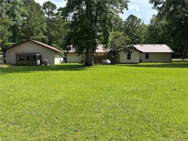 5200 Pineview Rd, Lumberton, NC 28360 - view of grassy yard with a pole building and an outdoor structure