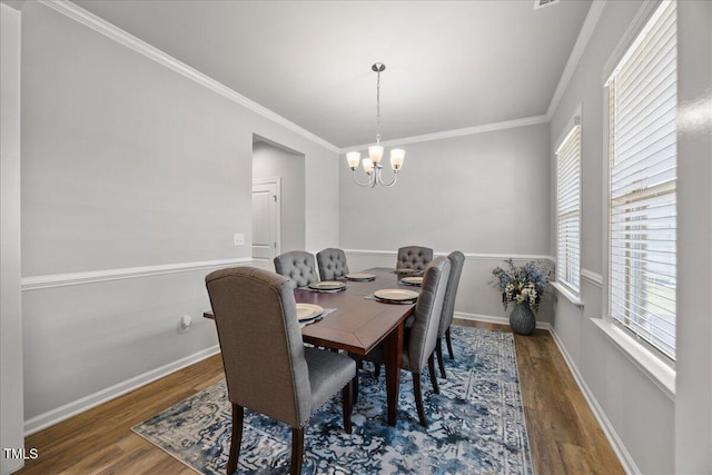 601 Richlands Cliff Dr, Youngsville, NC 27596 - dining room with wood finished floors, plenty of natural light, a chandelier, and crown molding