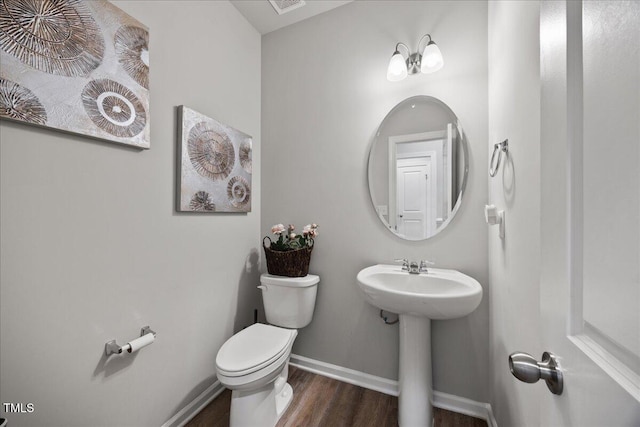 601 Richlands Cliff Dr, Youngsville, NC 27596 - half bathroom featuring toilet and wood finished floors