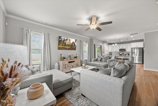 601 Richlands Cliff Dr, Youngsville, NC 27596 - living area featuring a ceiling fan, wood finished floors, ornamental molding, and recessed lighting