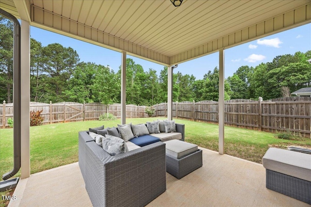 601 Richlands Cliff Dr, Youngsville, NC 27596 - fenced backyard with an outdoor living space, a patio area, and view of scattered trees