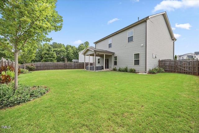 601 Richlands Cliff Dr, Youngsville, NC 27596 - back of house with a fenced backyard and a patio area
