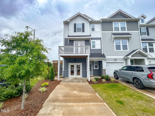 124 Sugar Run Dr Unit 11, Fuquay Varina, NC 27526 - townhome / multi-family property featuring french doors, concrete driveway, a garage, and a front lawn
