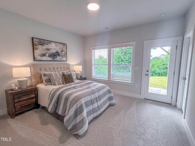 124 Sugar Run Dr Unit 11, Fuquay Varina, NC 27526 - carpeted bedroom with access to outside and baseboards