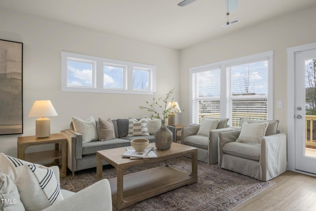 124 Sugar Run Dr Unit 11, Fuquay Varina, NC 27526 - living area with healthy amount of natural light, wood finished floors, and ceiling fan