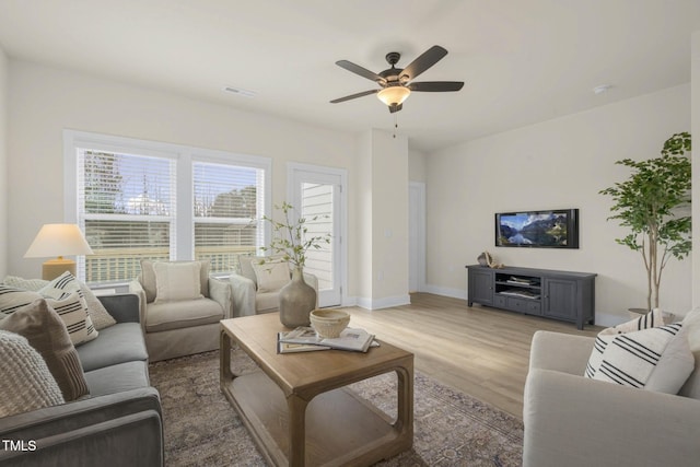 124 Sugar Run Dr Unit 11, Fuquay Varina, NC 27526 - living room featuring light wood-style flooring and a ceiling fan