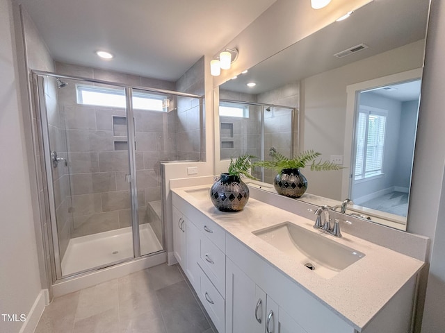 124 Sugar Run Dr Unit 11, Fuquay Varina, NC 27526 - bathroom featuring double vanity, a stall shower, and tile patterned flooring