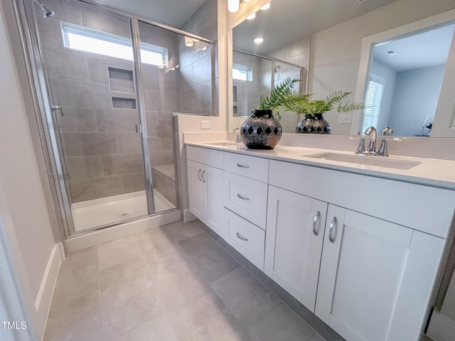 124 Sugar Run Dr Unit 11, Fuquay Varina, NC 27526 - bathroom featuring double vanity, a stall shower, and tile patterned flooring